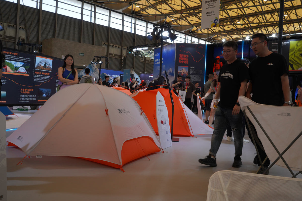 Outdoor tents and visitors at the ISPO Shanghai exhibition