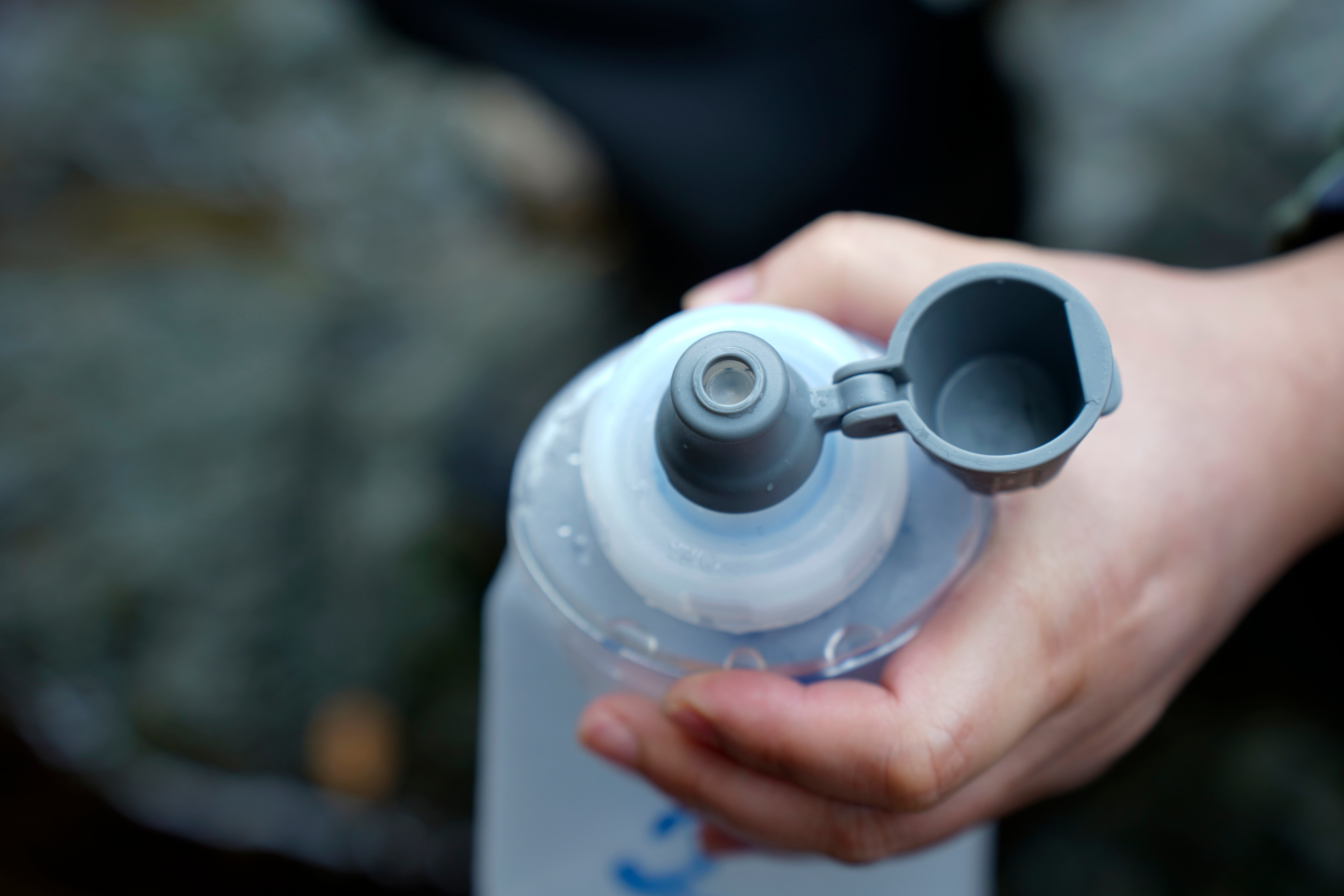 Close-up of the raised drinking spout and open dust cap